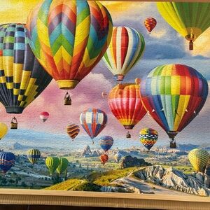 Buffalo Games 2000 piece “Up, Up And Away” jigsaw puzzle.